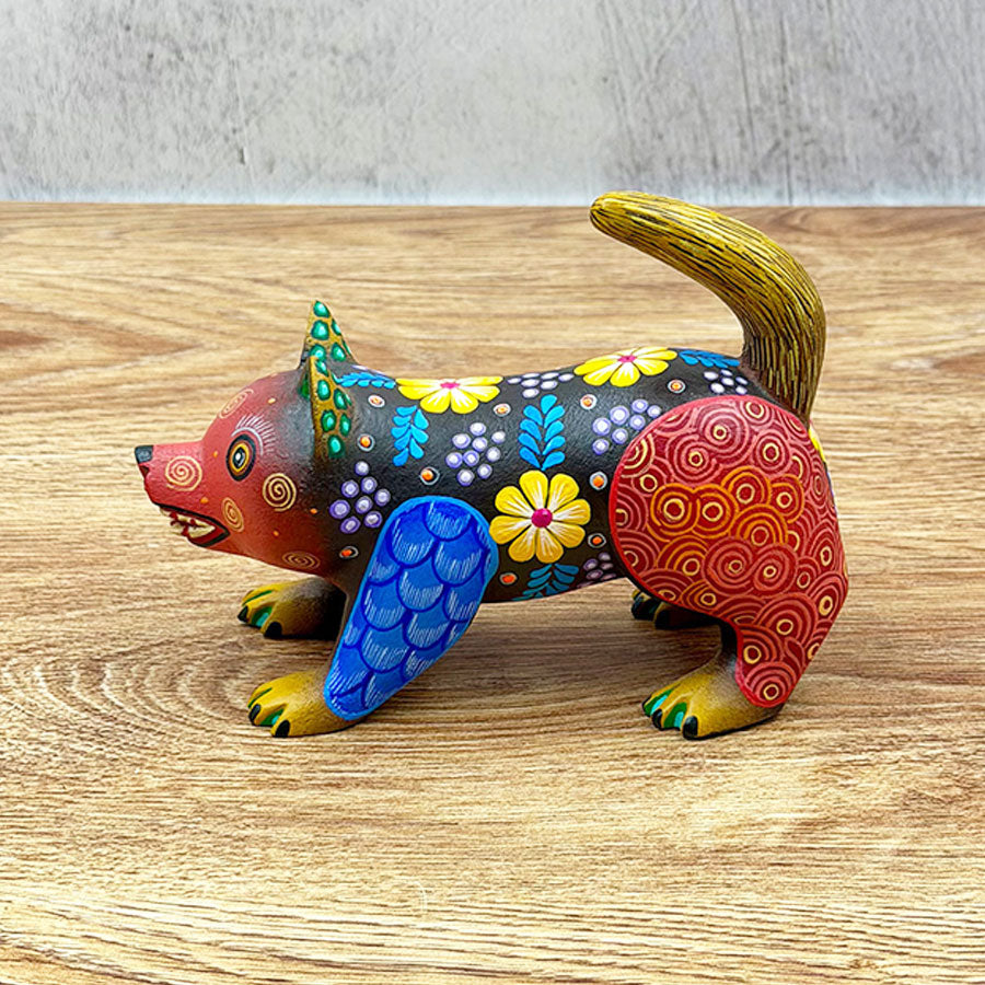 Black and red alebrije raccoon