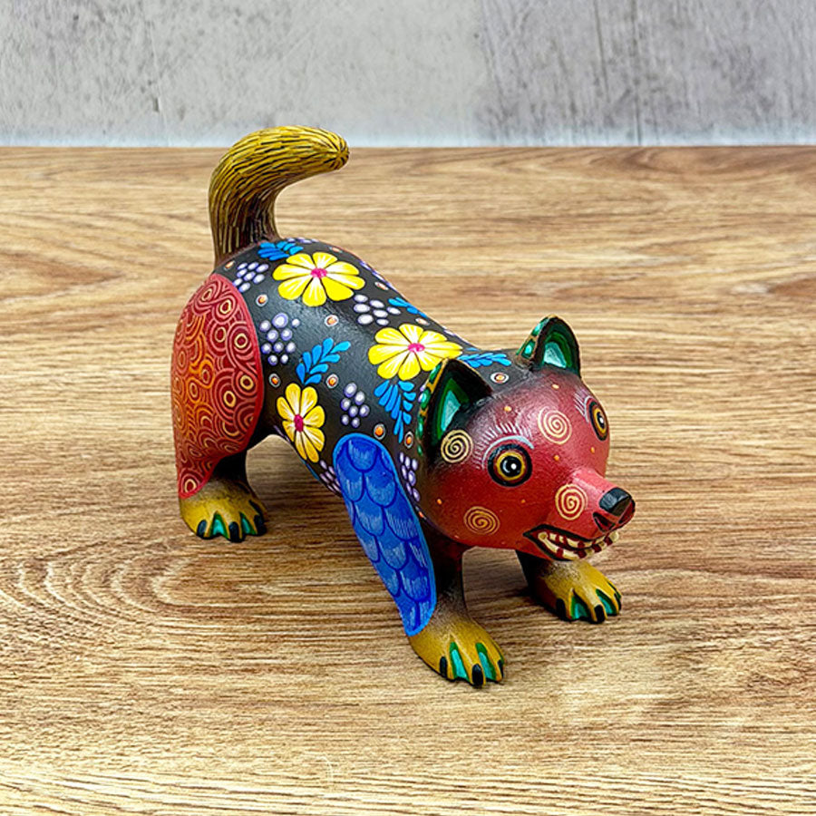 Black and red alebrije raccoon