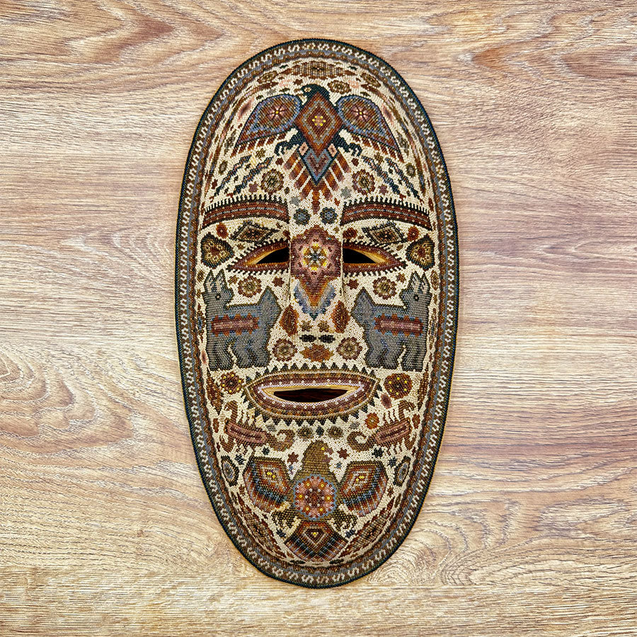 Blue mask with eagles in Huichol design