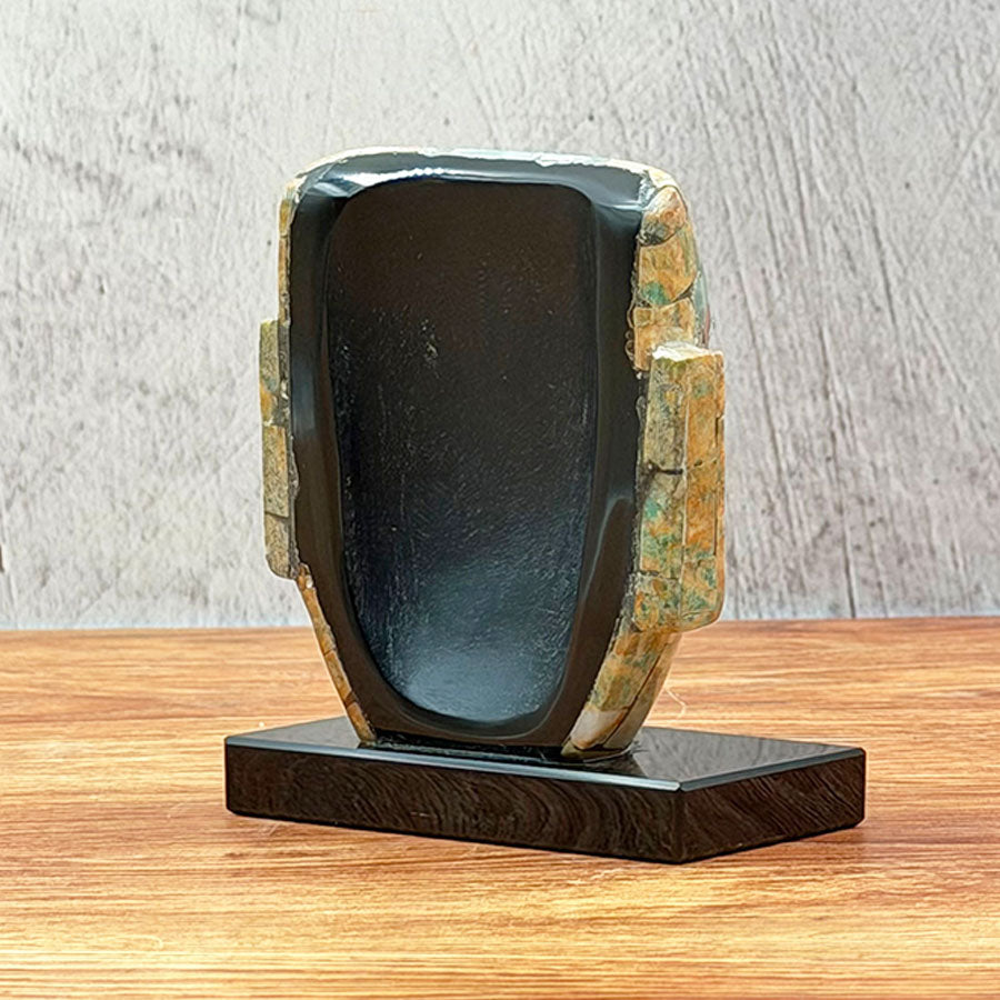 Teotihuacan mask made of obsidian lined with brown and green stone