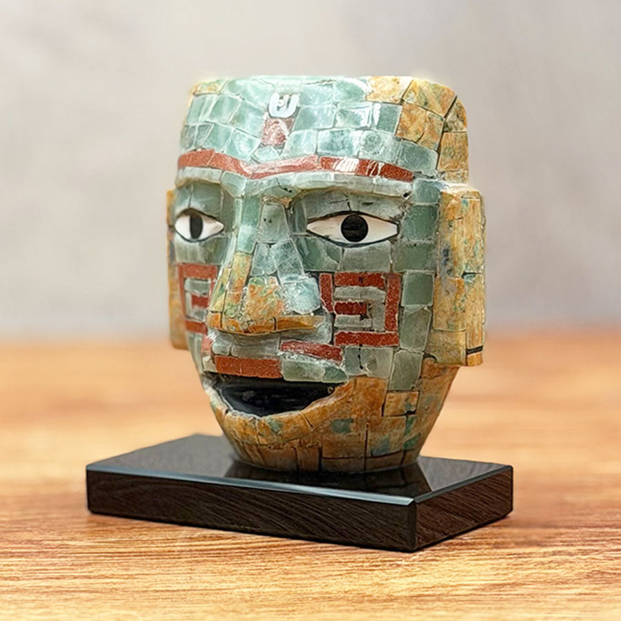 Teotihuacan mask made of obsidian lined with brown and green stone