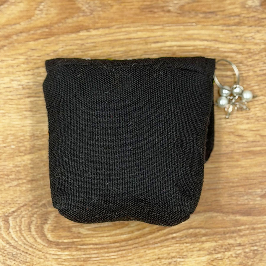 Black purse with embroidered Mexican scenes