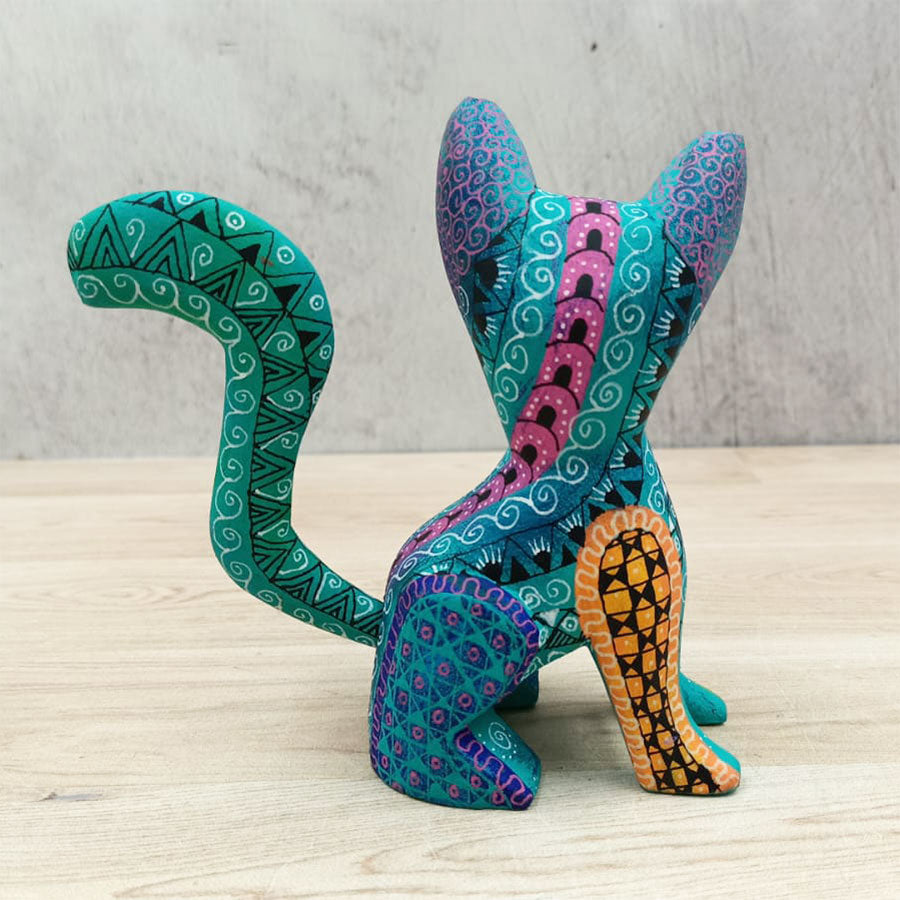Blue and green alebrije dog