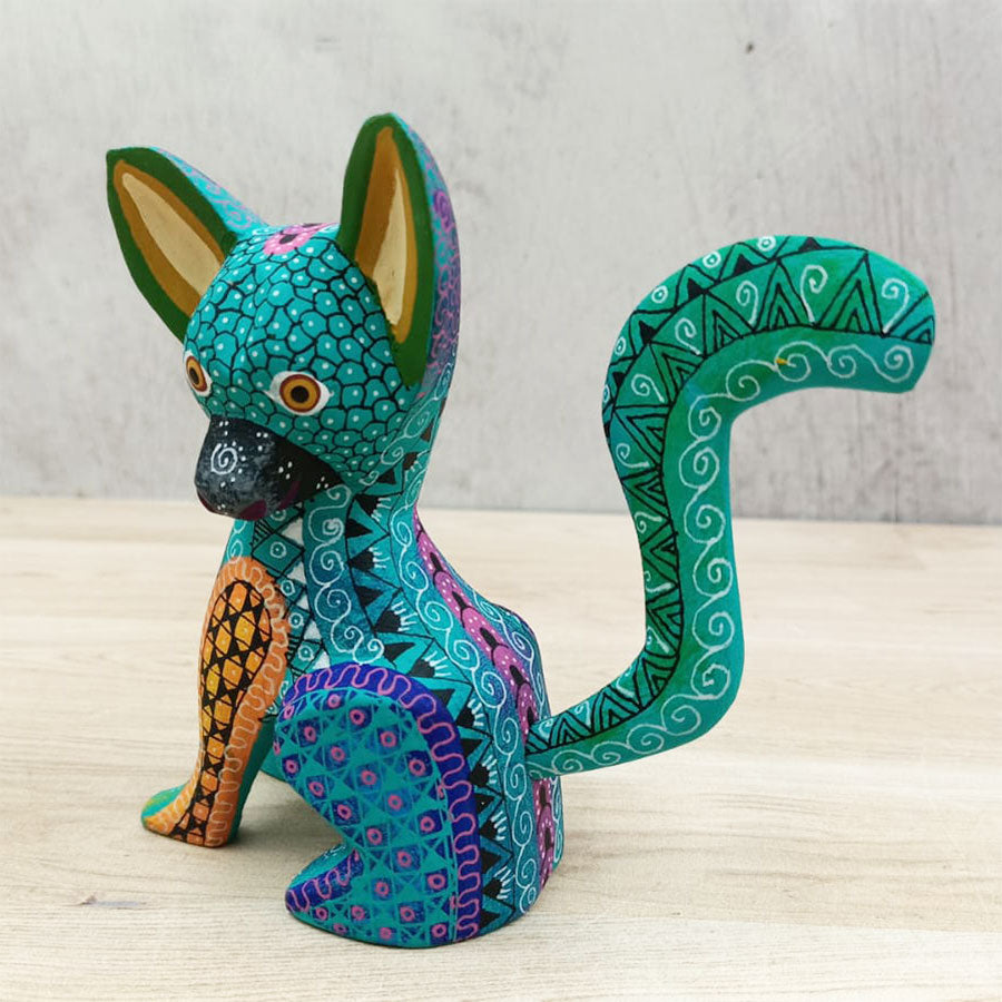 Blue and green alebrije dog
