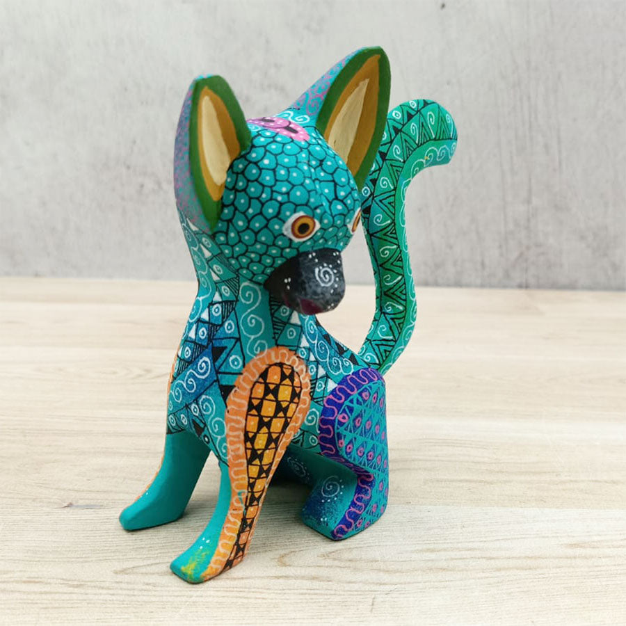 Blue and green alebrije dog