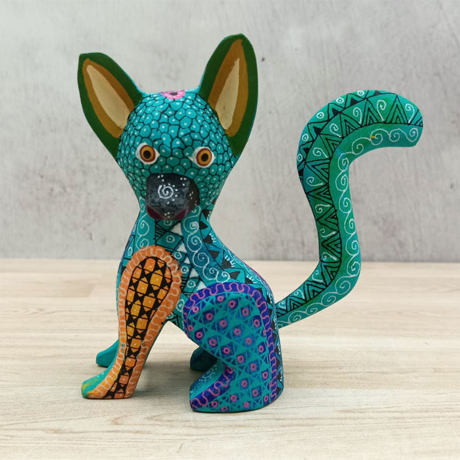 Blue and green alebrije dog