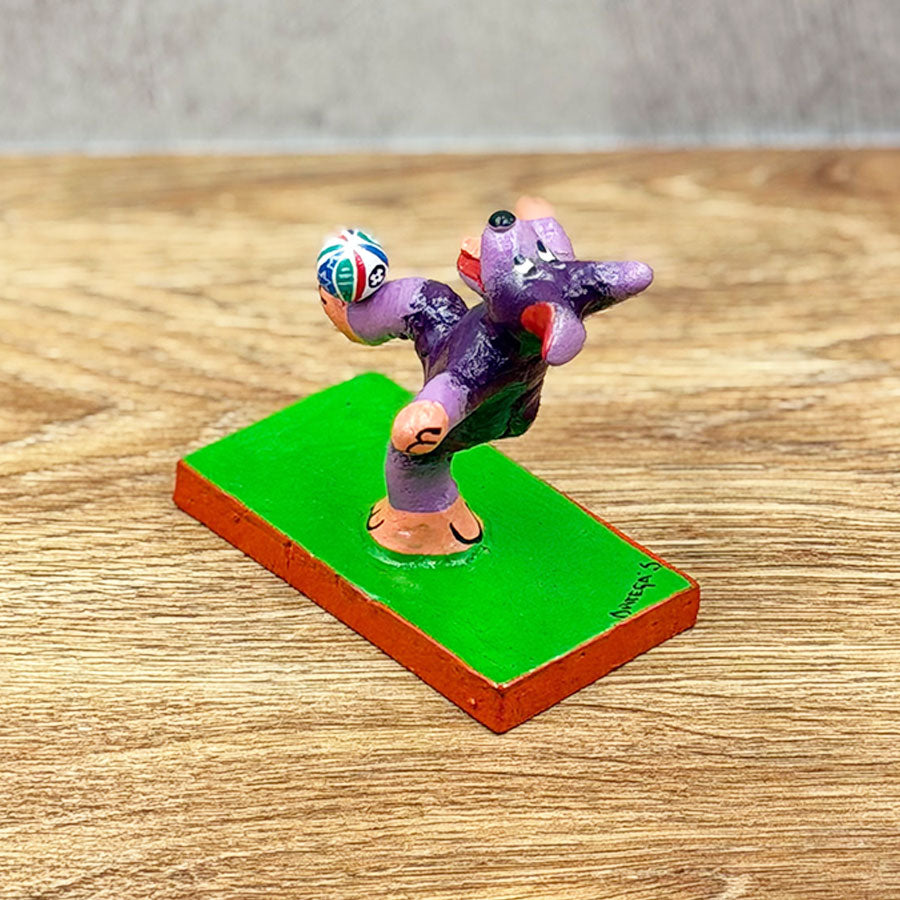 Soccer-playing dog with ball