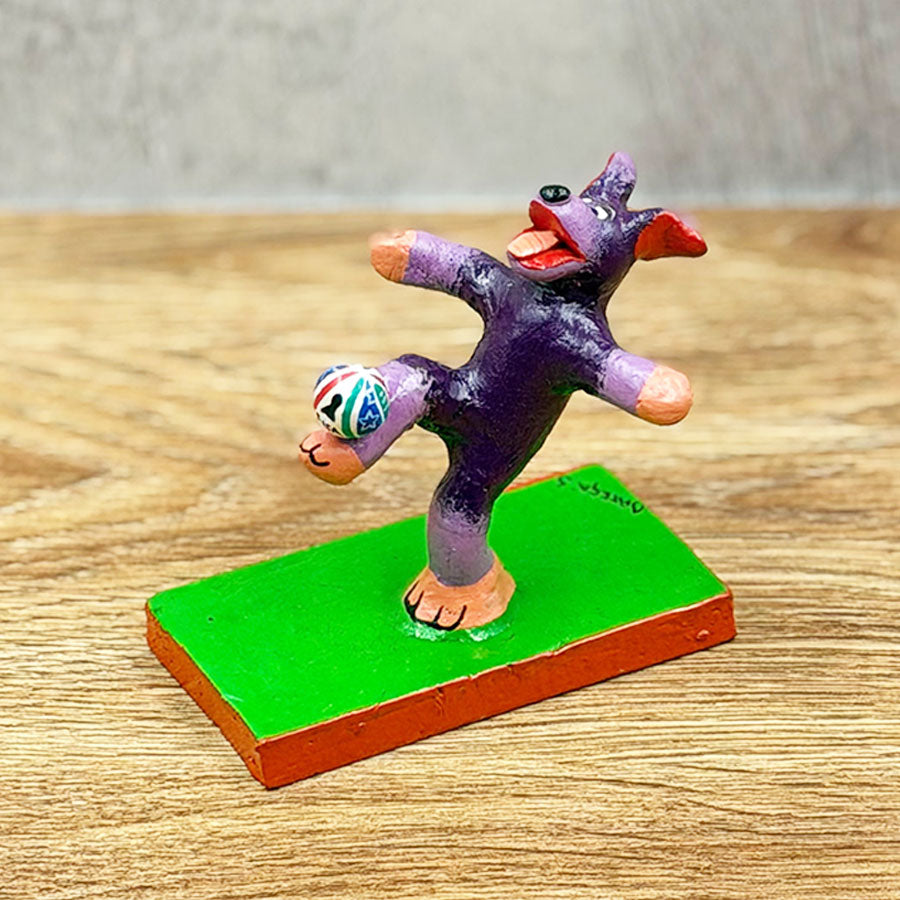 Soccer-playing dog with ball