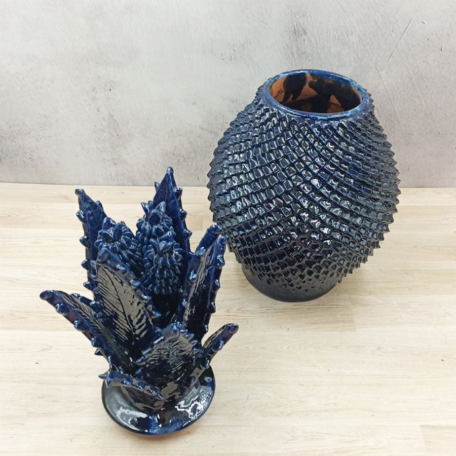 Navy blue pineapple with a fine peak design made of glazed clay