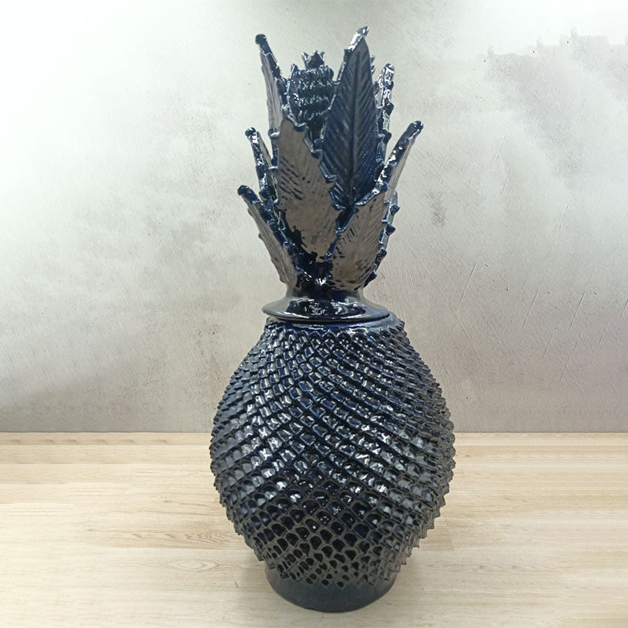 Navy blue pineapple with a fine peak design made of glazed clay
