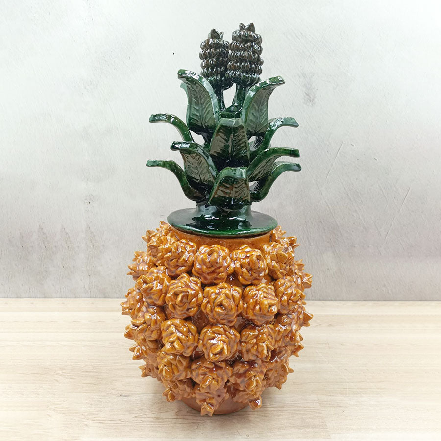 Pineapple with yellow rose design made of glazed clay