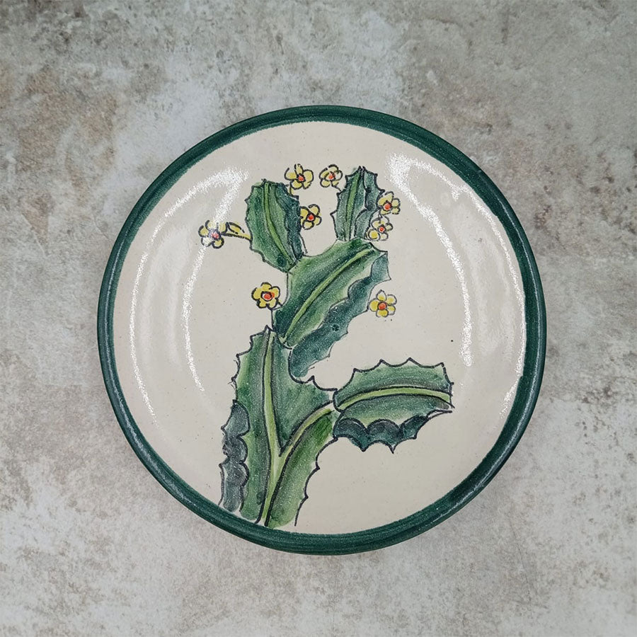 Plate decorated with a green rim