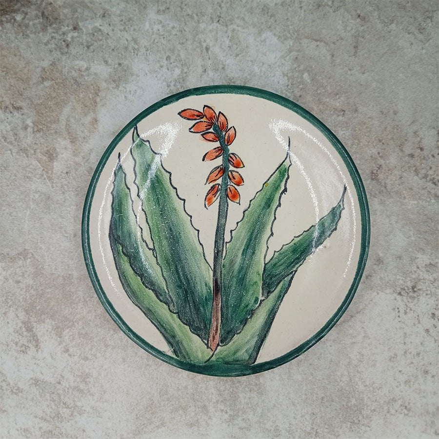 Plate decorated with a green rim