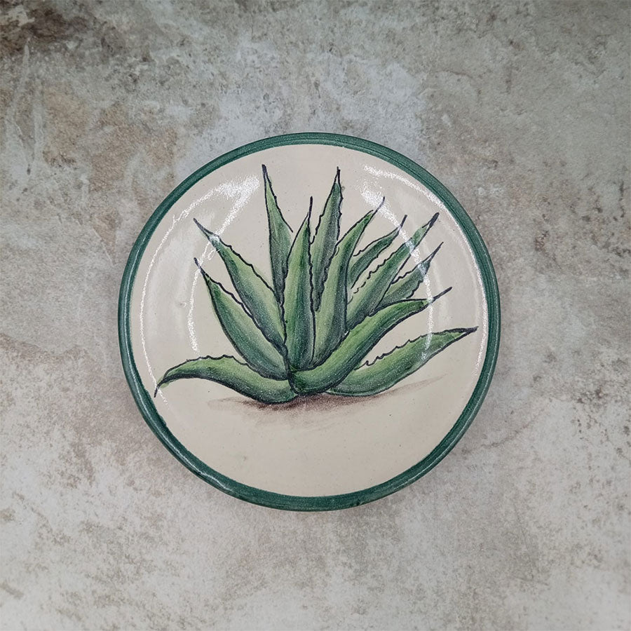 Plate decorated with a green rim