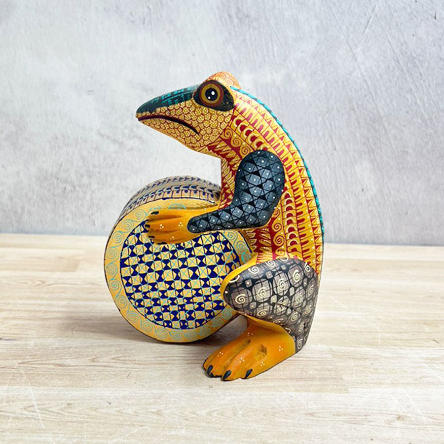 Yellow alebrije frog with drum