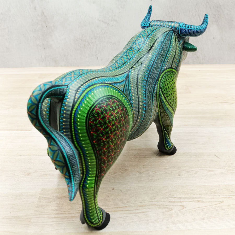 Green and blue alebrije bull