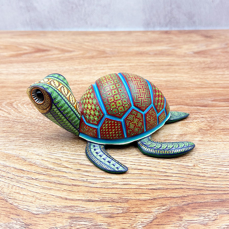 Red and green alebrije turtle