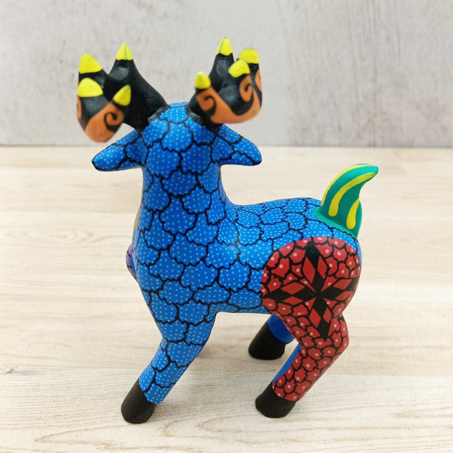 Blue and red alebrije deer