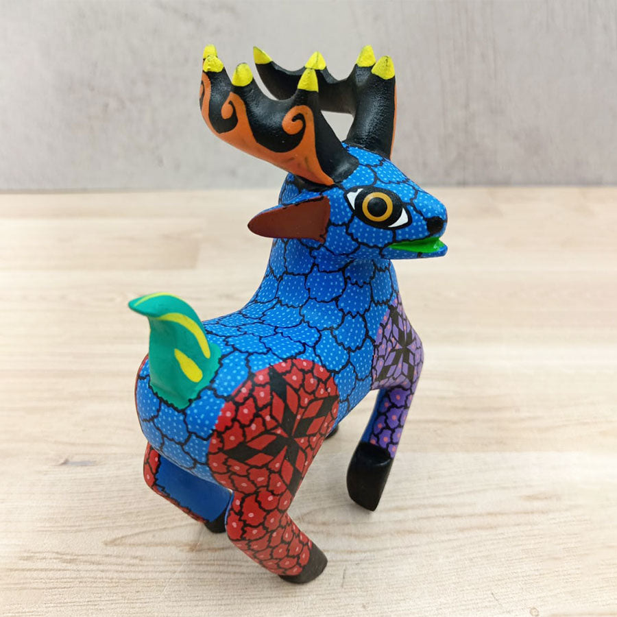 Blue and red alebrije deer